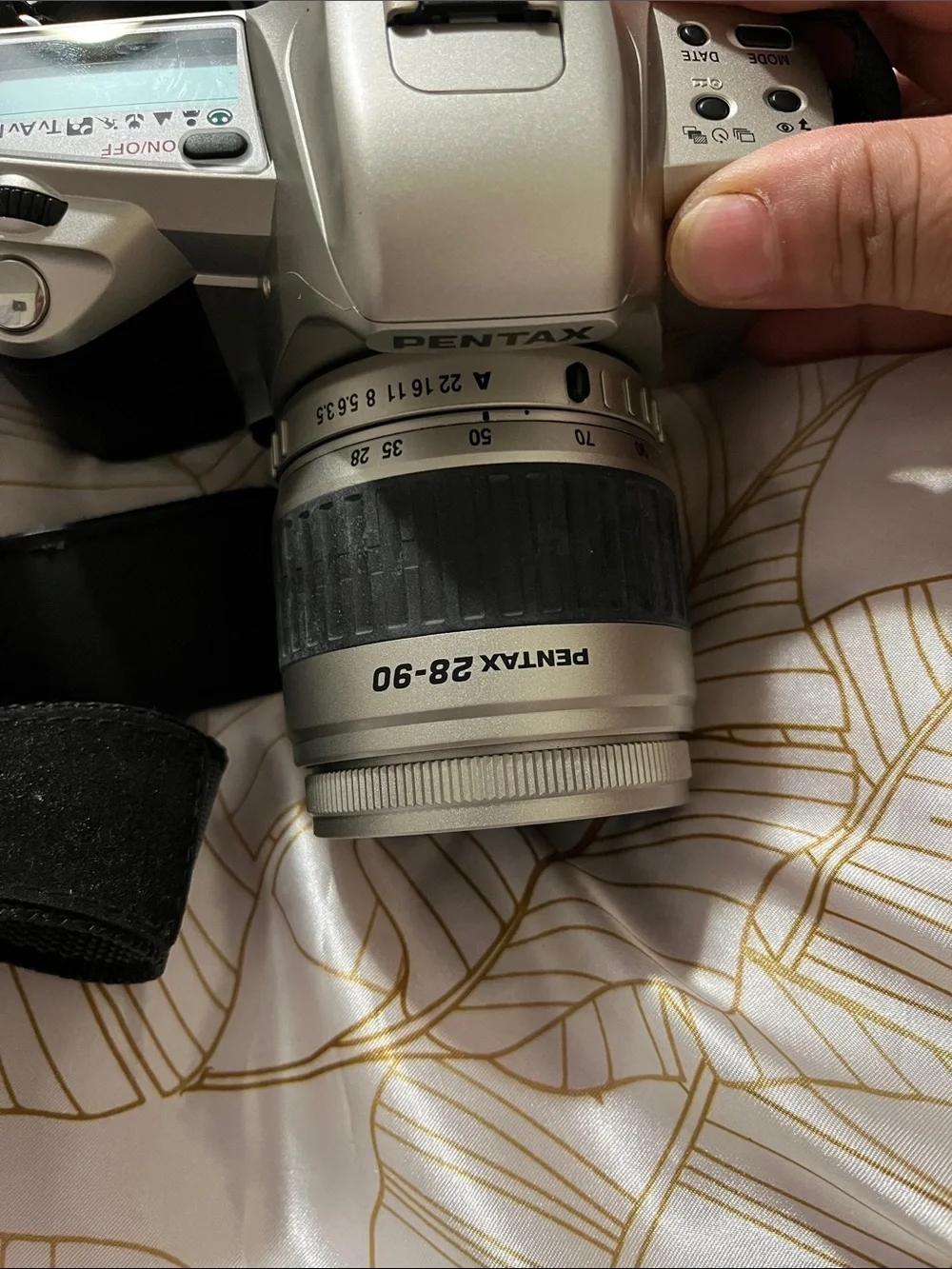 Pentax Silver and Black DSLR with 28-90mm Zoom Lens and Branded Strap